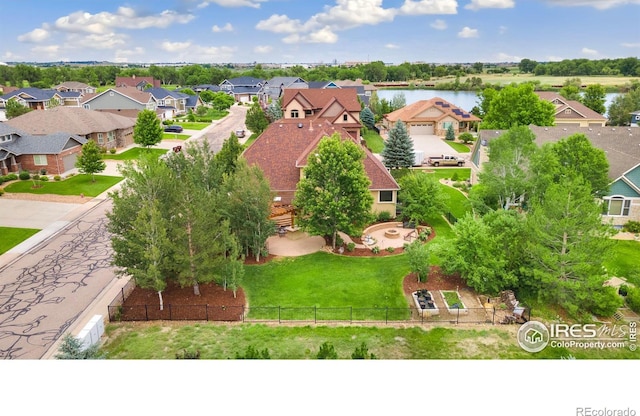 aerial view featuring a water view and a residential view