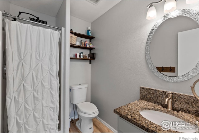 326 Riviera Ln, Johnstown, CO 80534 - bathroom featuring a shower with shower curtain, toilet, vanity, wood finished floors, and baseboards