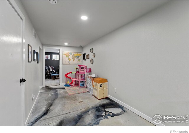 326 Riviera Ln, Johnstown, CO 80534 - rec room with baseboards, unfinished concrete flooring, and recessed lighting
