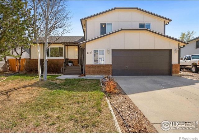 split level home with an attached garage, brick siding, fence, driveway, and a front lawn