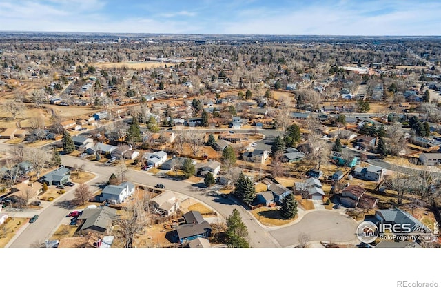 birds eye view of property with a residential view