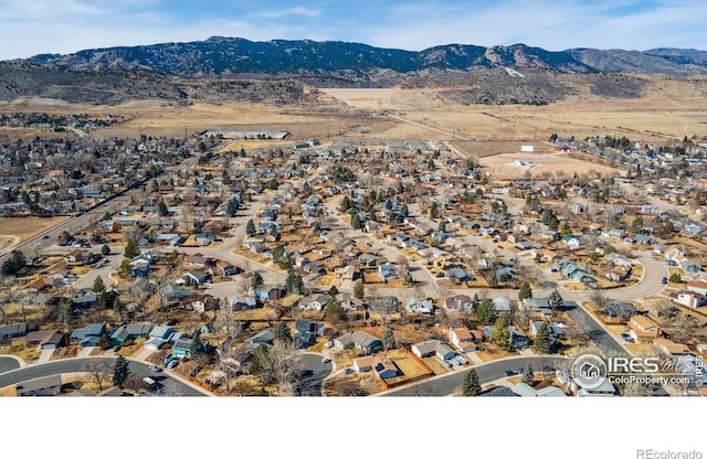 birds eye view of property with a residential view and a mountain view