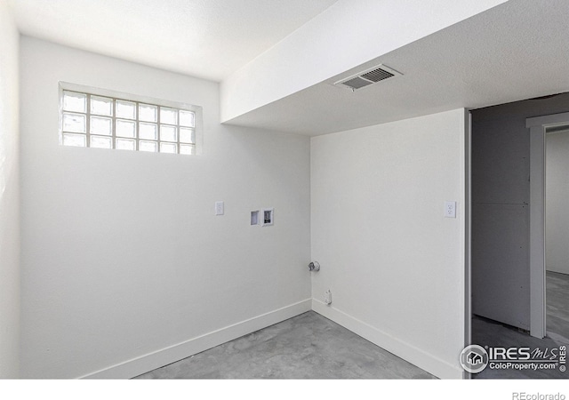 laundry room with laundry area, baseboards, visible vents, and washer hookup