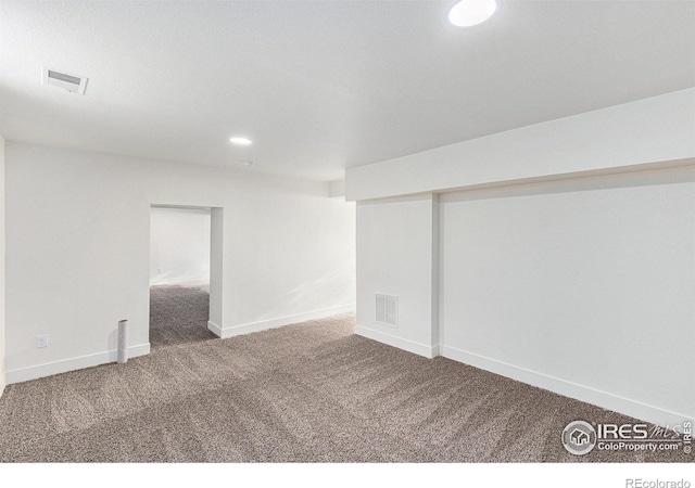 finished basement featuring baseboards, carpet floors, visible vents, and recessed lighting