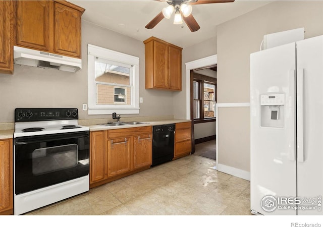 kitchen featuring black dishwasher, white refrigerator with ice dispenser, light countertops, under cabinet range hood, and range with electric stovetop