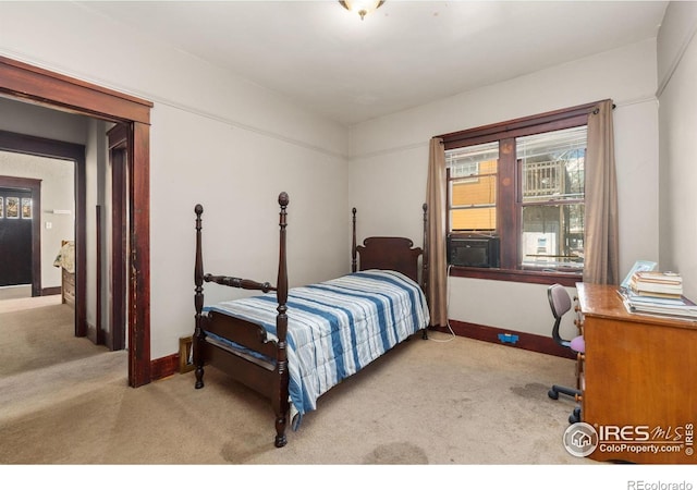 carpeted bedroom with baseboards