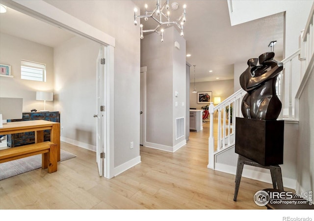 interior space with stairs, recessed lighting, wood finished floors, and baseboards