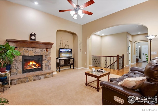 2185 Diamond Creek Dr, Colorado Springs, CO 80921 - living room featuring light carpet, a stone fireplace, baseboards, and recessed lighting