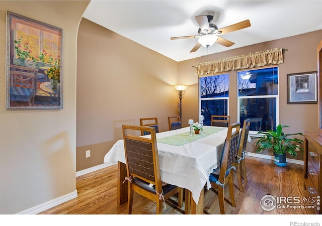 2185 Diamond Creek Dr, Colorado Springs, CO 80921 - dining room with ceiling fan, baseboards, and wood finished floors