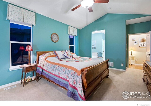 2185 Diamond Creek Dr, Colorado Springs, CO 80921 - bedroom with lofted ceiling, visible vents, light carpet, and baseboards