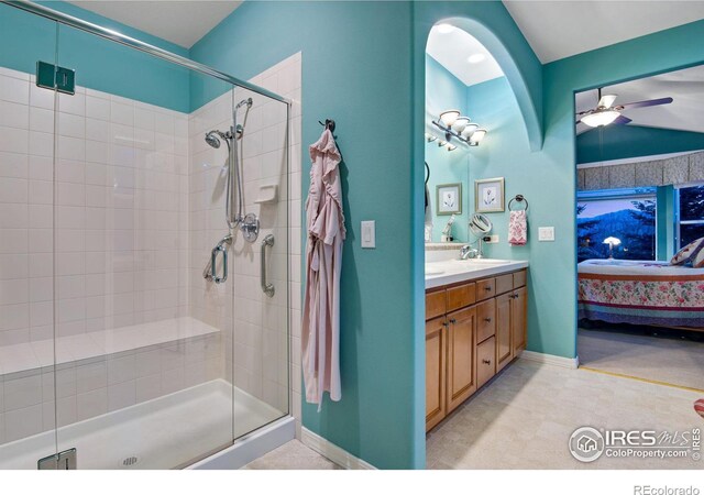 2185 Diamond Creek Dr, Colorado Springs, CO 80921 - bathroom featuring double vanity, ensuite bath, a ceiling fan, and a shower stall