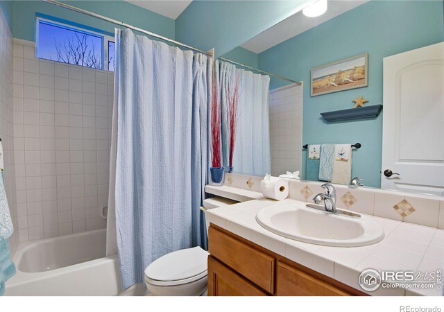 2185 Diamond Creek Dr, Colorado Springs, CO 80921 - full bath with toilet, shower / bathtub combination with curtain, and vanity