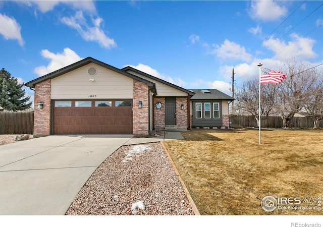 ranch-style home featuring a garage, brick siding, fence, concrete driveway, and a front lawn