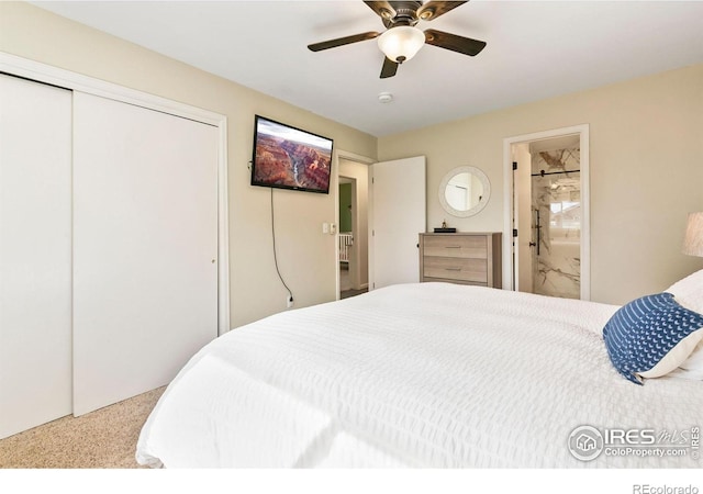 bedroom with ceiling fan, a closet, and ensuite bath