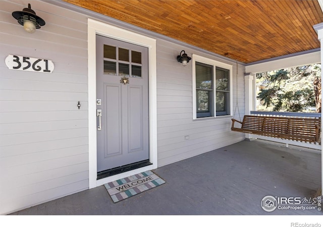 entrance to property with a porch