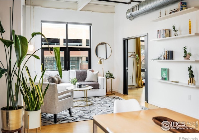 living area featuring light wood-style flooring