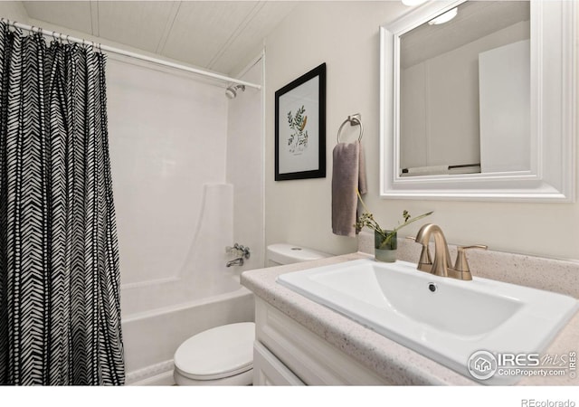 full bathroom with toilet, shower / bathtub combination with curtain, and vanity