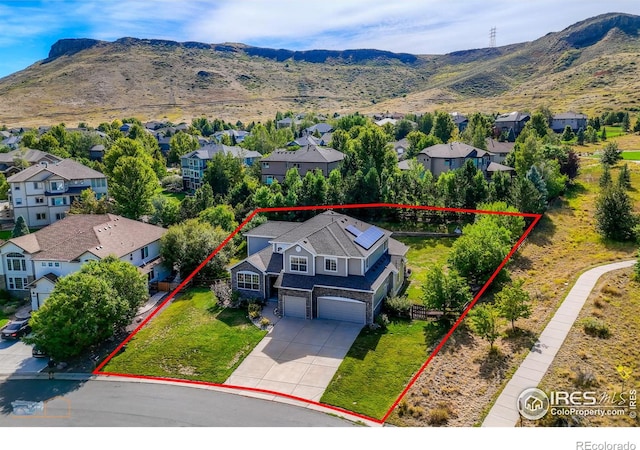 bird's eye view with a residential view and a mountain view