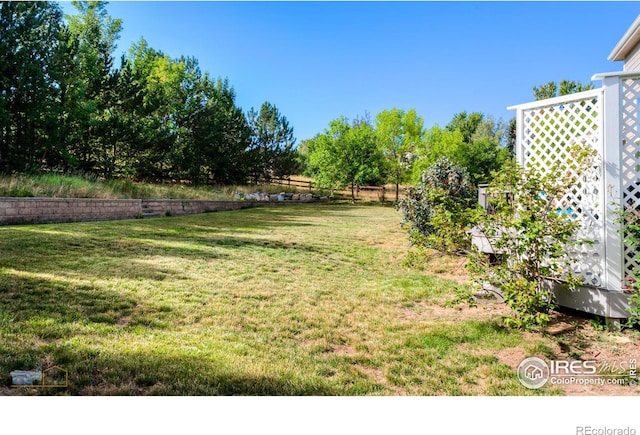 view of yard featuring fence