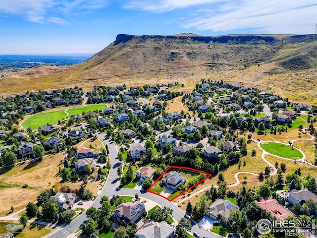 birds eye view of property featuring a residential view and a mountain view