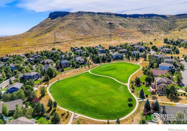 drone / aerial view featuring a residential view and a mountain view