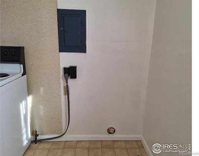 washroom with washer / clothes dryer, electric panel, baseboards, and laundry area