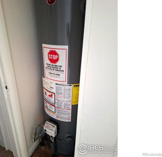 utility room featuring water heater