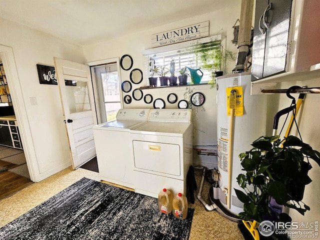 laundry room featuring laundry area, washer and clothes dryer, and gas water heater