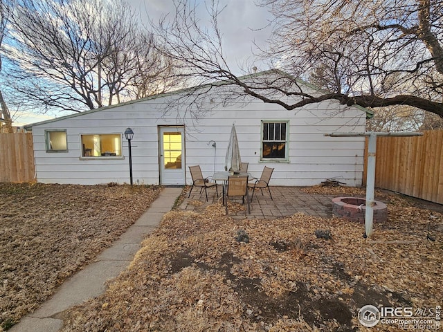 back of house with a patio area and fence