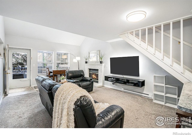 carpeted living room with lofted ceiling, stairway, a baseboard radiator, and a fireplace