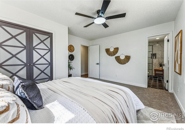 bedroom with ensuite bath, a textured ceiling, baseboards, and carpet flooring