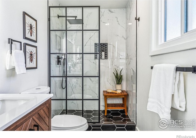 bathroom with a walk in shower, toilet, and vanity