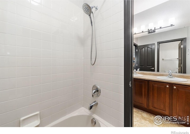 bathroom featuring tile patterned floors, vanity, and shower / bathtub combination