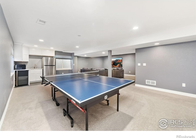 game room with baseboards, recessed lighting, visible vents, and light colored carpet