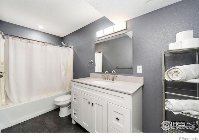 bathroom featuring a textured wall, tile patterned flooring, toilet, vanity, and shower / bath combo with shower curtain