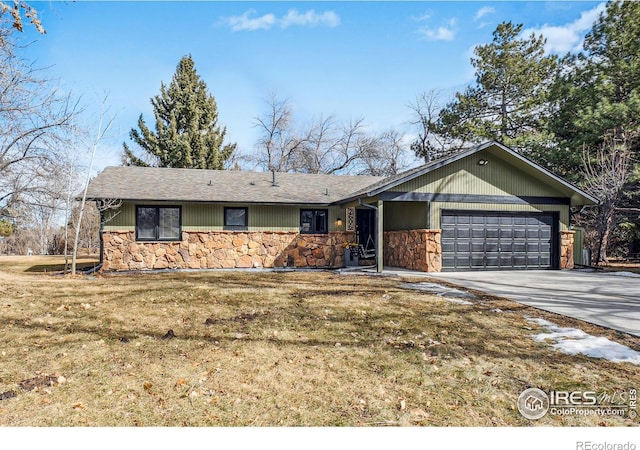 ranch-style home featuring a garage, a front lawn, stone siding, and driveway