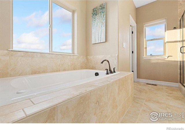 full bathroom featuring tile patterned floors, visible vents, a shower stall, and a bath