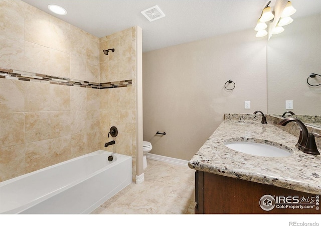 full bathroom featuring double vanity, visible vents, toilet, and a sink