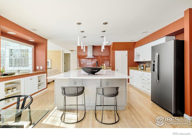 1516 Columbine Ave, Boulder, CO 80302 - kitchen featuring light wood-type flooring, stainless steel refrigerator with ice dispenser, white cabinets, and a sink