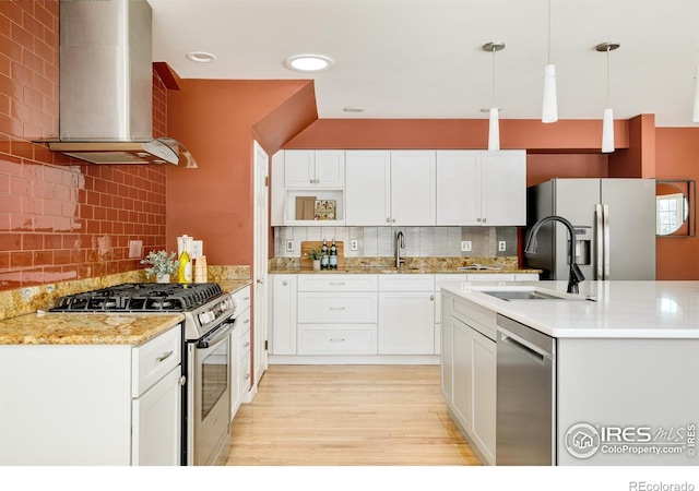 1516 Columbine Ave, Boulder, CO 80302 - kitchen with wall chimney range hood, tasteful backsplash, stainless steel appliances, and a sink