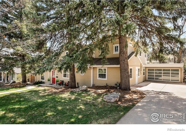 1516 Columbine Ave, Boulder, CO 80302 - view of front facade with an attached garage, driveway, and a front yard