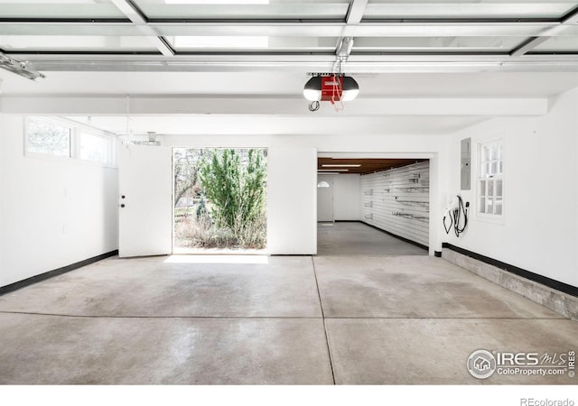 1516 Columbine Ave, Boulder, CO 80302 - garage with a garage door opener, electric panel, and baseboards