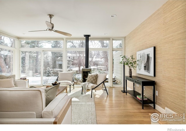 1516 Columbine Ave, Boulder, CO 80302 - living room with ceiling fan, expansive windows, a healthy amount of sunlight, and light wood-style floors