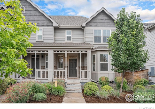 view of front of house with a shingled roof