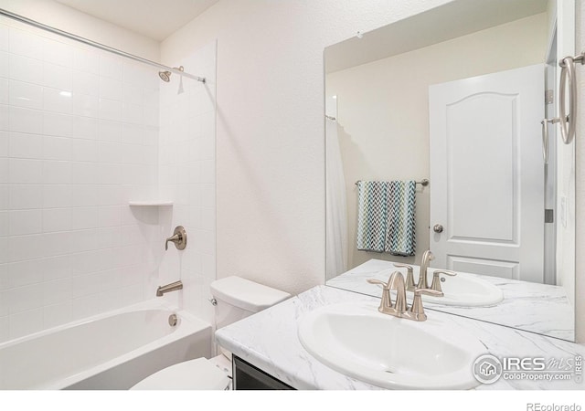 full bathroom with toilet, washtub / shower combination, and vanity