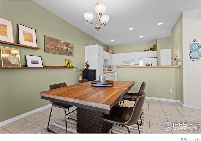 dining room featuring recessed lighting, baseboards, a notable chandelier, and light tile patterned flooring