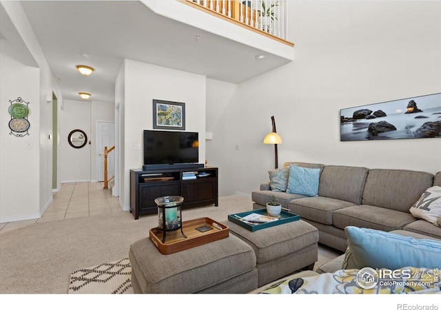 living room with light carpet and light tile patterned floors