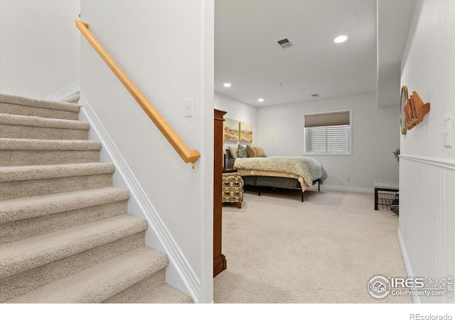 carpeted bedroom with visible vents and recessed lighting