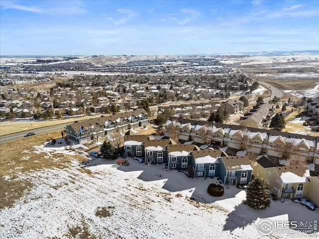 snowy aerial view featuring a residential view