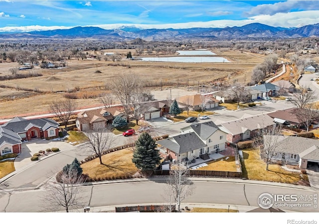 birds eye view of property featuring a residential view and a mountain view